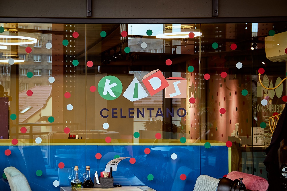 Kids area in a restaurant with colorful decorations and seating